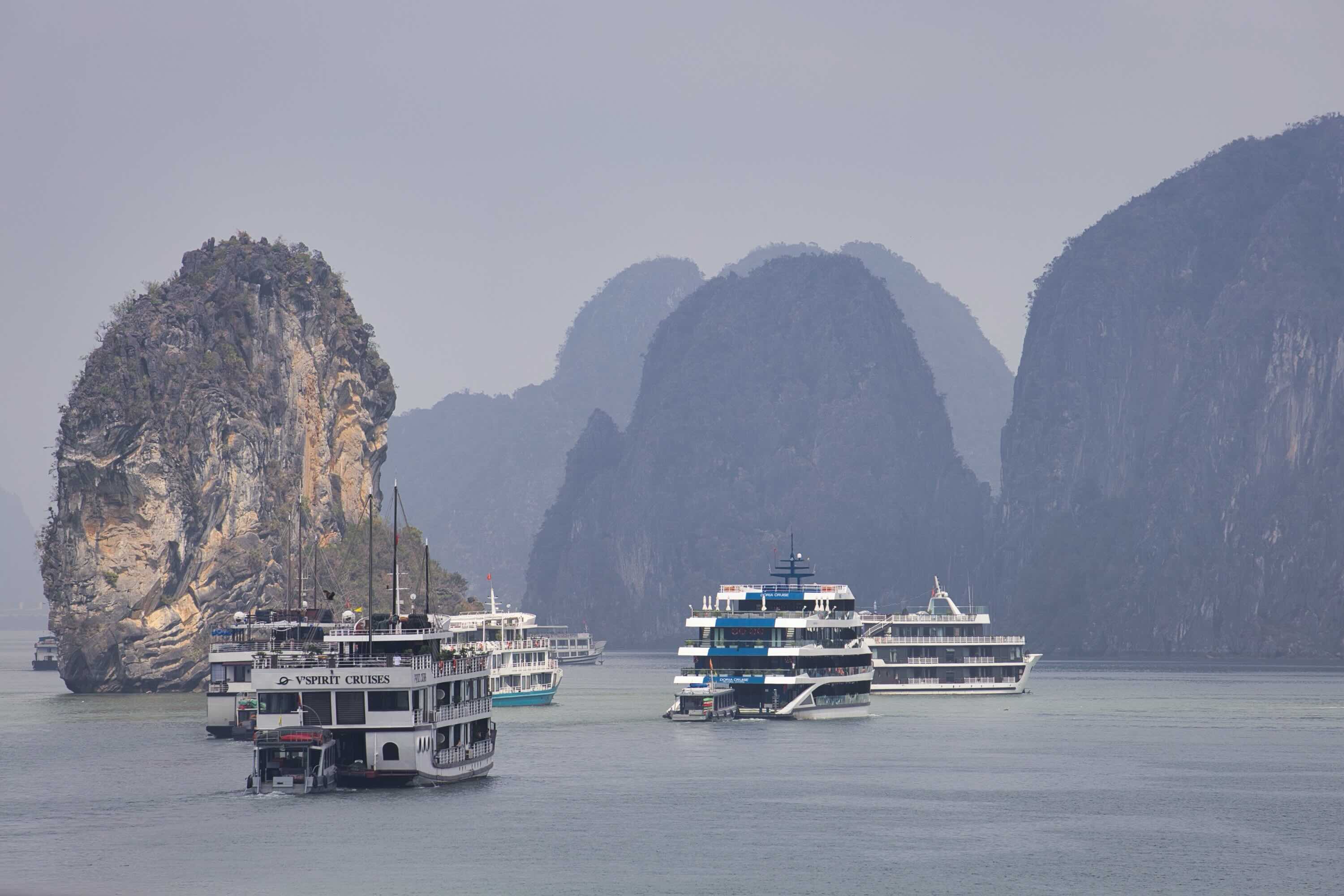 Boats following one another in Lan Ha Bay