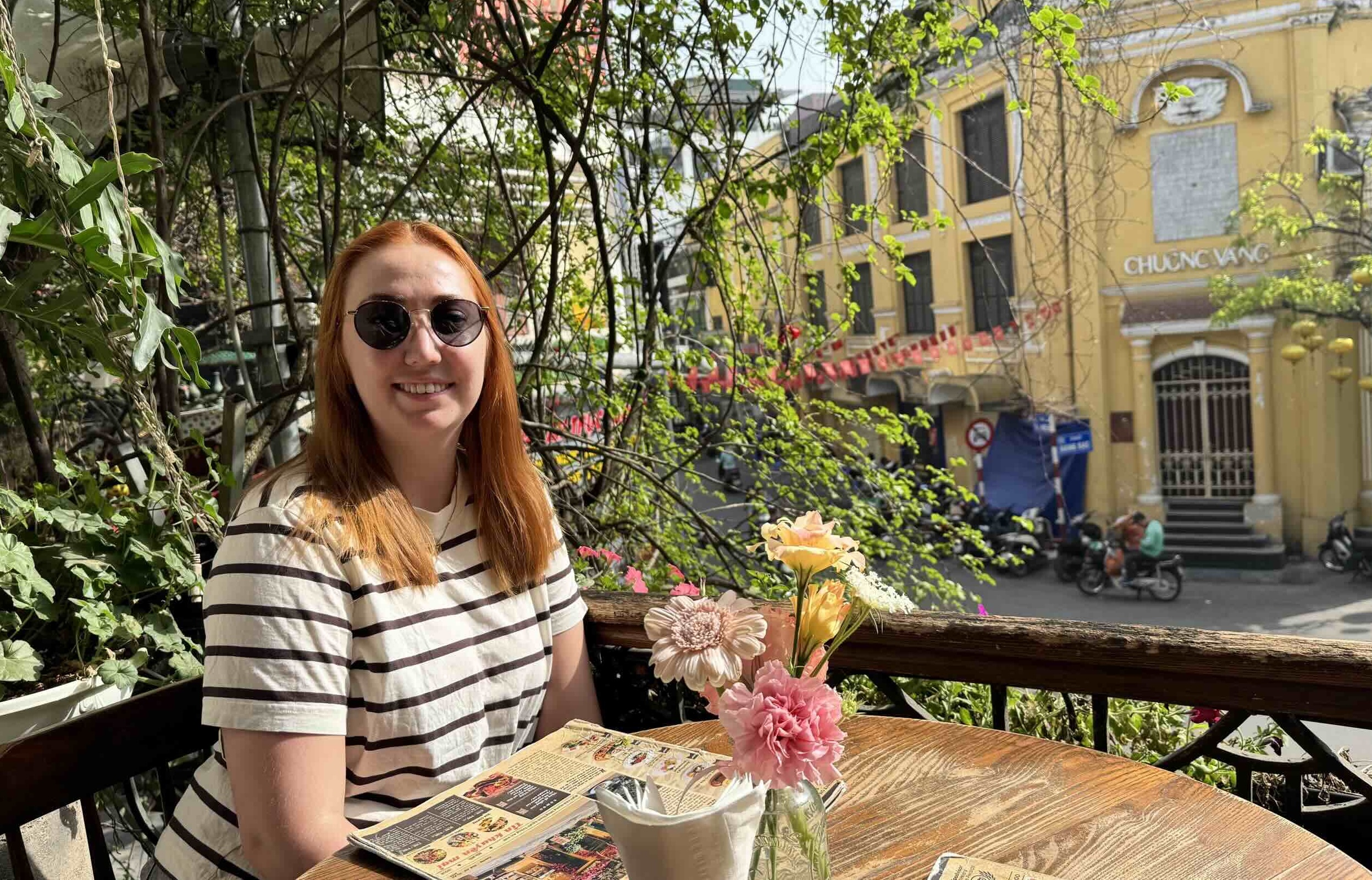 Having brunch on a scenic balcony overlooking Hanoi