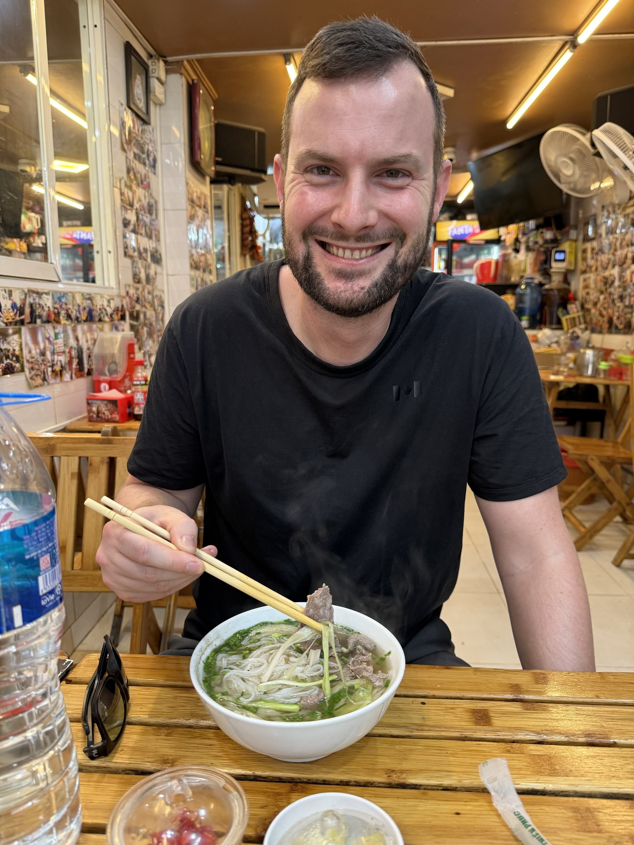 Kristian enjoying a bowl of traditional beef Pho