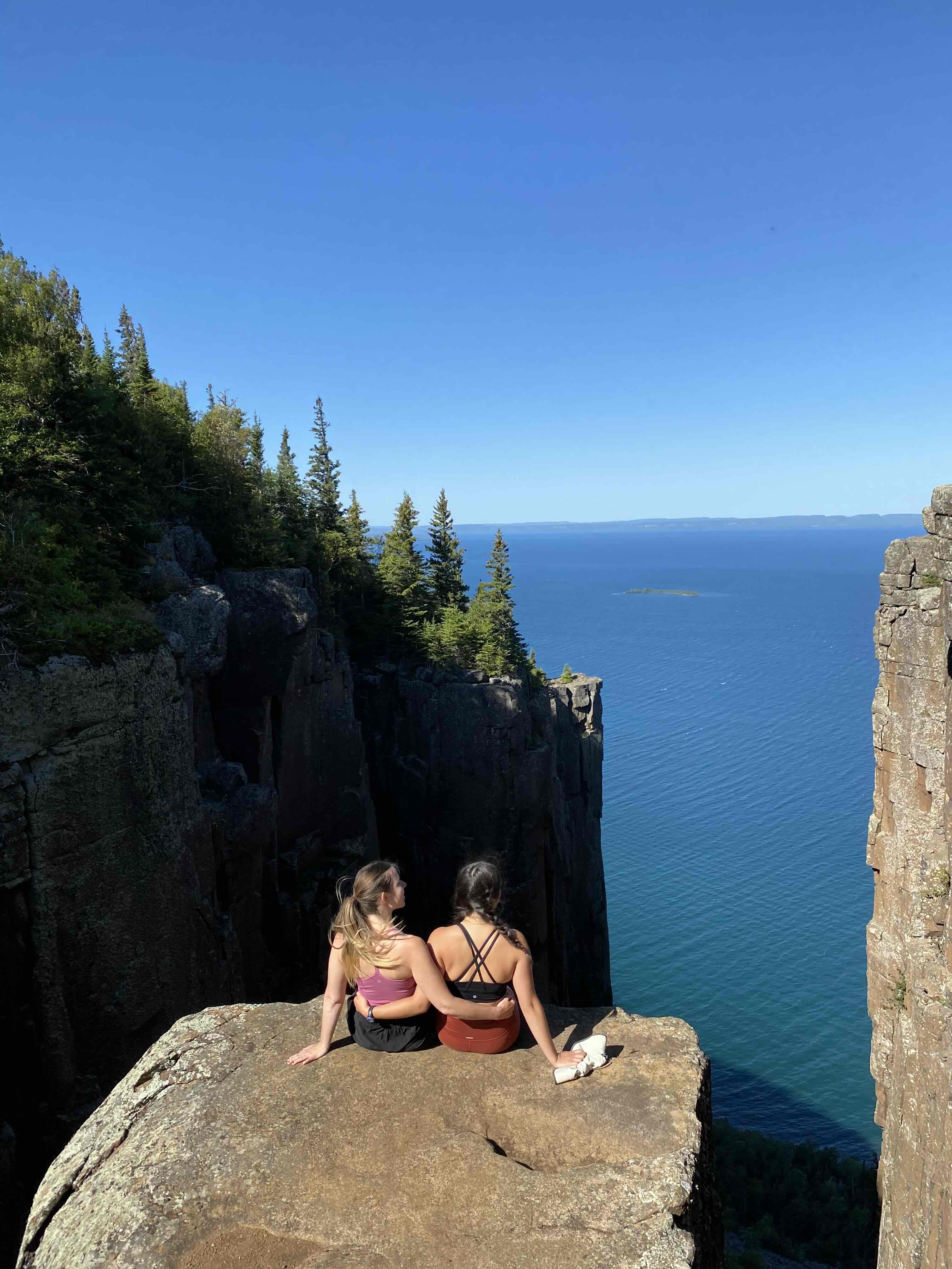 Girls posing on rock in canyon