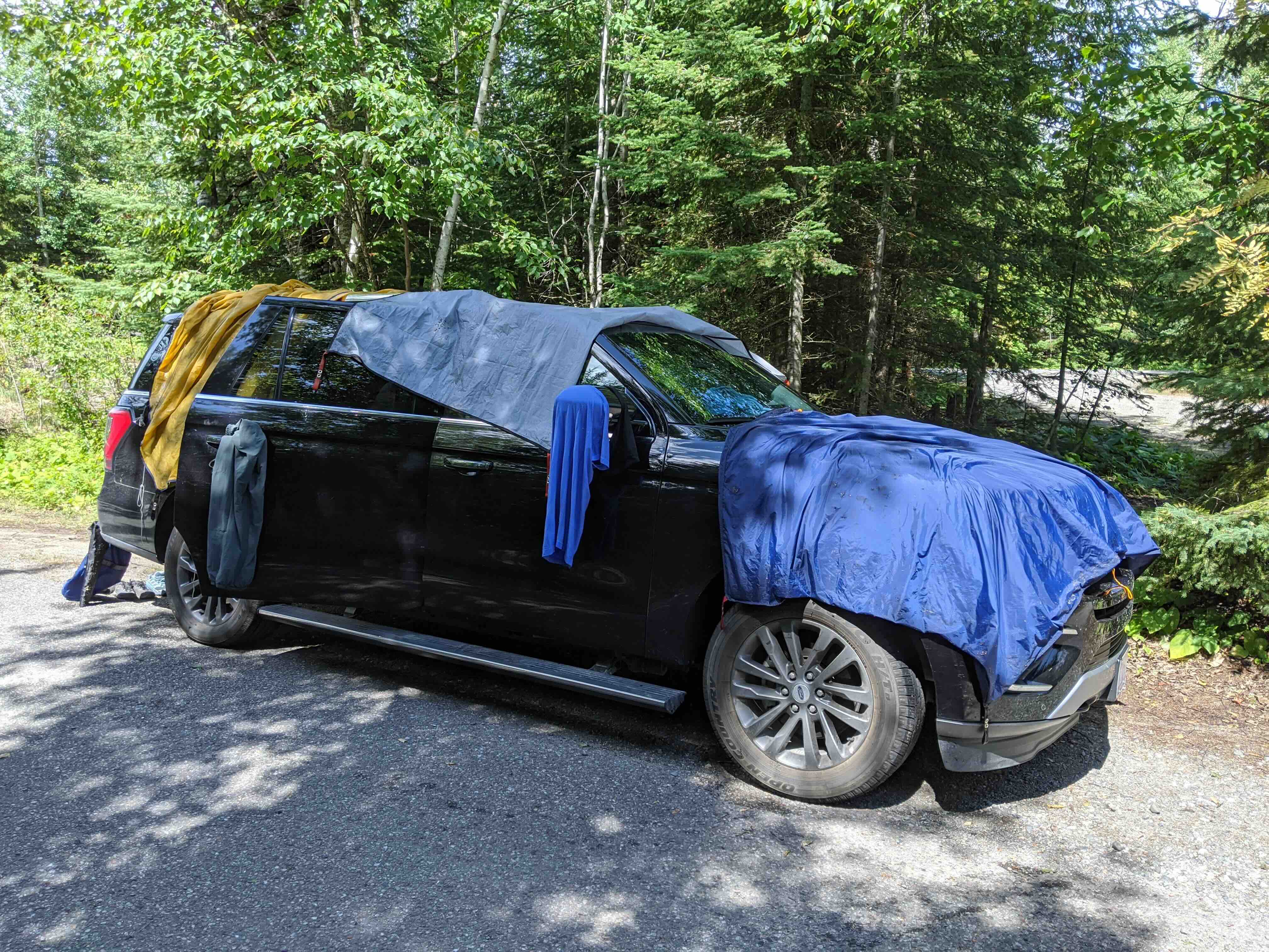 car with tents drying ontop